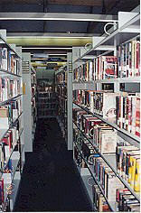 View of typical aisle of book shelves.