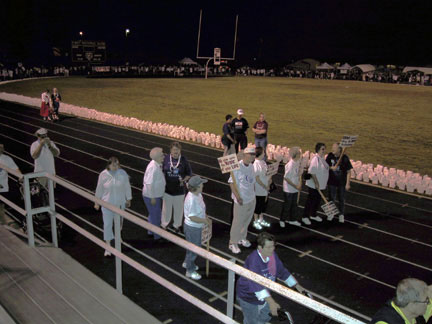 Road to Recovery Volunteer Drivers assemble to take their lap around the track following  the Survivors Walk.