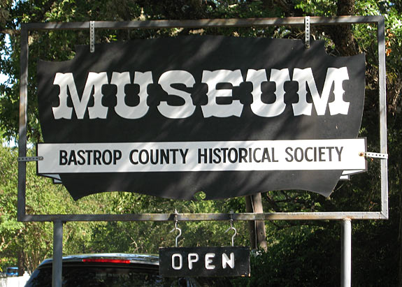 Welcome sign to the Bastrop County Historical Society Museum