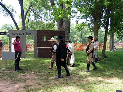 The Texas Pistolaros, gunfight re-enactors, in action. This group performed skits and some pose here before performances.