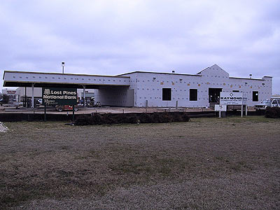 To allow for the new HEB project, the present Lost Pines National Bank will be torn down and be rebuilt on the lot in front of the present HEB building on Highway 71 and Hasler Boulevard. 