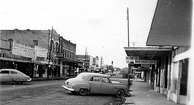 Street widening of Main Street in downtown Bastrop (facing north) in the early 1950's
